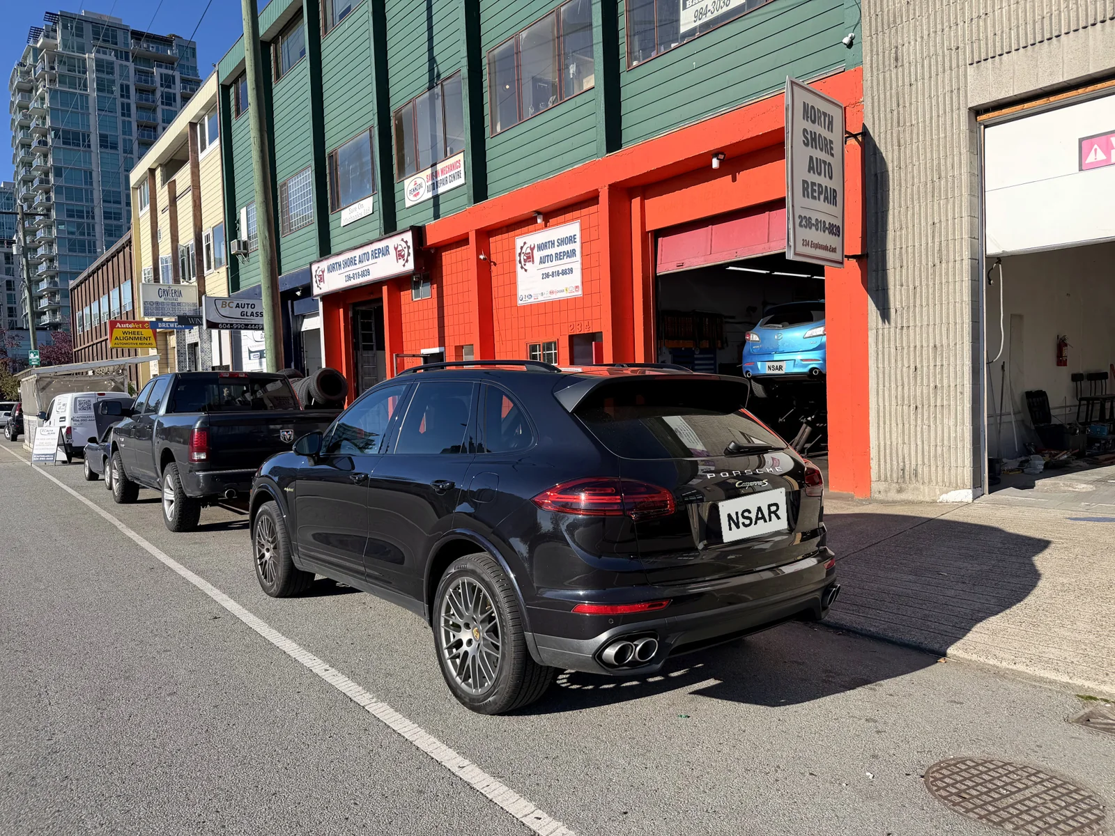 Porsche Cayenne Hybrid outside North Shore Auto Repair